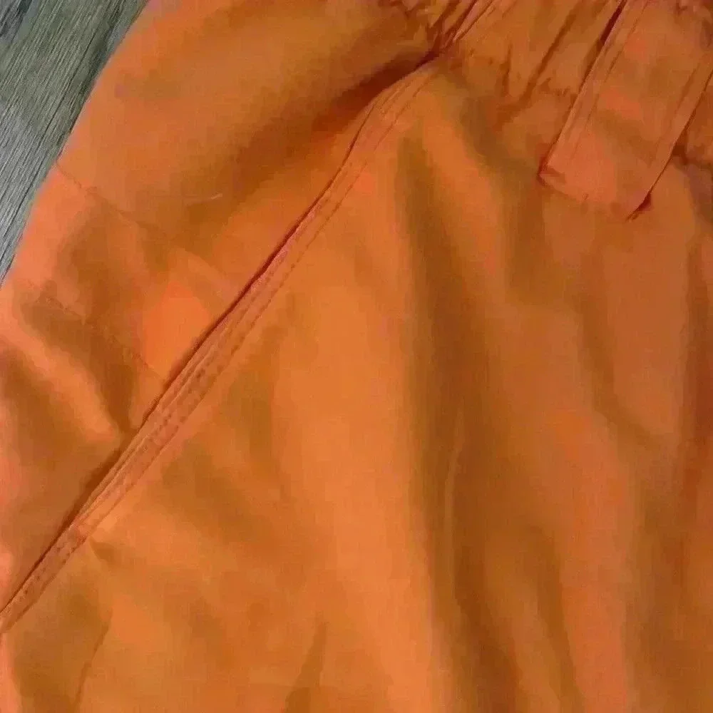 Men’s North Face orange swim suit; size L